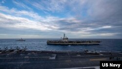 美军罗斯福号航母(USS Theodore Roosevelt) 与尼米兹号(USS Nimitz)航母2021年2月9日在南中国海举行双航母联演(美国海军照片)