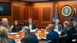 In this image provided by the White House, President Joe Biden, along with members of his national security team, receive an update on an ongoing airborne attack on Israel from Iran, as they meet in the Situation Room of the White House, Apr. 13, 2024.