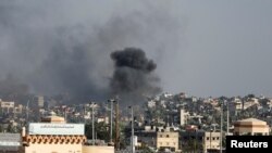 Smoke rises after an Israeli airstrike, amid the ongoing conflict between Israel and Palestinian Islamist group Hamas, in Khan Younis, southern Gaza Strip, December 9, 2023.