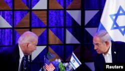 Rais wa Marekani Joe Biden akiwa katika mazungmzo na waziri mkuu wa Israel Benjamin Netanyahu Oktoba 18, 2023