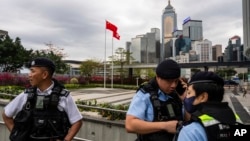 香港立法会通过根据《基本法》第23条订立的新的国家安全法案期间,香港警察在立法会外站岗。(2024年3月19日)(2024年3月19日)