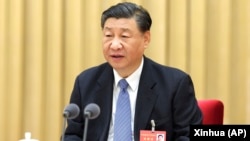 中国领导人习近平在北京举行的年度中央经济工作会议上讲话。(2023年12月12日)