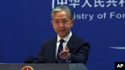 资料照片:中国外交部发言人汪文斌在记者会上。(美联社2023年2月13日照片)