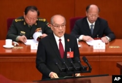 中国最高人民法院院长张军在北京人大会堂举行的全国人大会议上发表工作报告。(2024年3月8日)