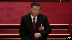 2023 年 3 月 5 日,中国国家主席习近平出席在北京人民大会堂举行的全国人民代表大会开幕式。(美联社照片/Ng Hanguan)