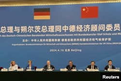 德国总理朔尔茨与中国总理李强在北京出席中德经济顾问委员会的会议。(2024年4月16日)