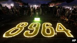Hundreds of participants attend a candlelight vigil at Democracy Square in Taipei, Taiwan, June 4, 2023, to mark the 34th anniversary of the Chinese military crackdown on the pro-democracy movement in Beijing's Tiananmen Square.