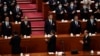 资料照片:习近平(中)出席2023年3月11号在北京召开的中国第十四届人大第一次会议。