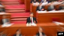 中国领导人习近平在北京人大会堂出席全国人大会议开幕式。(2024年3月4日)