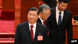 中共领导人习近平和前领导人胡锦涛在北京人大会堂出席中共二十大开幕式。(2022年10月16日)