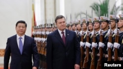 时任乌克兰总统亚努科维奇2013年12月访问中国推进乌中战略伙伴关系。(路透社)