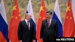 中国国家主席习近平在北京会晤到访的俄罗斯总统普京。(2022年2月4日)