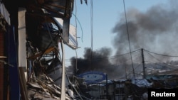 Plumes of smoke rise from a Russian strike during a 36-hour cease-fire over Orthodox Christmas declared by Russian President Vladimir Putin, as Russia's attack on Ukraine continues, from the frontline Donbas city of Bakhmut, Ukraine, Jan. 7, 2023.