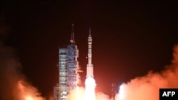 资料照片:2022 年 11 月 29 日晚,长征二号 F 运载火箭搭载神舟十五号飞船和三名宇航员前往中国天宫空间站,从中国西北部甘肃省酒泉卫星发射中心升空。