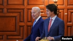 资料照片:2023年1月10日,美国总统拜登和加拿大总理贾斯汀·特鲁多出席在墨西哥城举行的北美领导人峰会。(路透社照片)