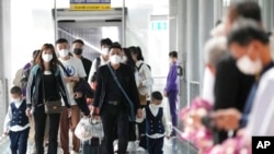 资料照片:中国游客抵达泰国国际机场。(2023年1月9日)