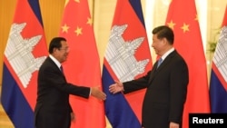 资料照片:中国国家主席习近平在北京与柬埔寨首相洪森举行会晤。(2019年4月29日)