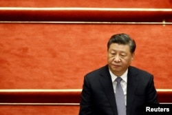 资料照“中国领导人习近平在北京人大会堂举行的全国政协十三届五次会议开幕式上。(2022年3月4日)