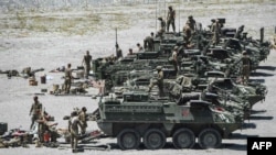American troops stand by Stryker armoured fighting vehicles after participating in live fire drills as part of the annual U.S.-Philippines joint military exercises at Crow Valley in Capas, Tarlac province, Philippines in this April 10, 2019 file photo.