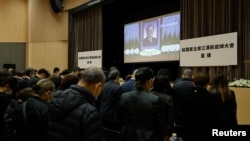 直播北京人民大会堂江泽民追悼会的一个香港会场。(路透社2022年12月6日)