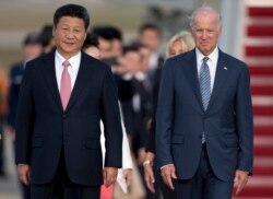 资料照:中国国家主席习近平与时任美国副总统拜登