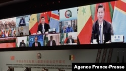 资料照片:中国国家主席习近平在塞内加尔举行的中非合作论坛上发表讲话(2021年11月29日)