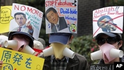 日本民众周日在东京聚会,抗议使用核电