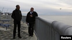 U.S. President Barack Obama (L) tours the Kotzebue Shore Avenue Project, an effort to protect against rising sea levels in Kotzebue, Alaska Sept. 2, 2015.