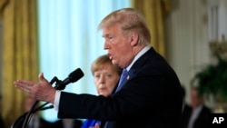 Дональд Трамп і Анґела Меркель