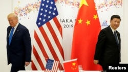 资料照:2019年6月29日,特朗普与中国领导人习近平在日本大阪出席G20国家领导人峰会期间举行双边会晤。