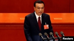 中国国务院总理李克强2018年3月5日在北京人民大会堂举行的全国人大会议开幕式上发表政府工作报告。