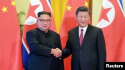 中国领导人习近平在北京接见到访的朝鲜领导人金正恩。 (2018年6月20日)