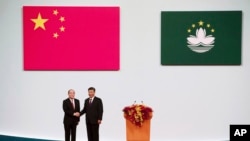 中国国家主席习近平2019年12月会见澳门特首贺一诚(美联社)