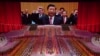 资料照:中国共产党成立100周年前夕的一场庆祝活动上,屏幕显示国家主席习近率领官员诵读对党的效忠誓词。(2021年6月28日,美联社)