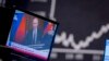 Ілюстративне фото. Звернення президента Росії Володимира Путіна в екрані телевізора, 25 лютого 2022 року. (AP Photo/Michael Probst, File)