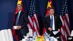美国总统奥巴马和中国主席习近平在联合国气候大会上(2015年11月30日)