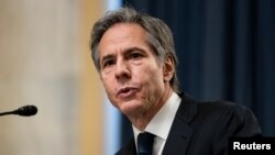 拜登的国务卿人选布林肯(Anthony Blinken)2021年1月19日在参议院外委会接受质询(路透社转发媒体联访照片)