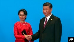 资料照:中国国家主席习近平在北京会见到访的缅甸领导人昂山素季。(2017年5月15日)