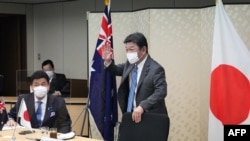 日本外务大臣茂木敏冲和防卫大臣岸信夫与澳大利亚外交部长玛莉丝∙佩恩(Marise )和国防部长彼特∙杜顿(Peter Dutton)举行2+2视频会议。(2021年6月9日)