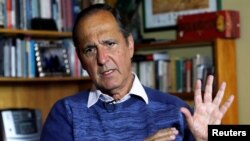 FILE - Juan Camilo Restrepo, Colombia's government representative for peace negotiations with the ELN (National Freedom Army), speaks during an interview with Reuters in Bogota, Colombia, Sept. 12, 2017.