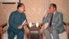资料照片:1987年,中国前副总理习仲勋(左)在北京与达赖喇嘛的胞兄嘉乐顿珠交谈。