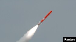 FILE - Pakistan's Babur Hatf VII cruise missile takes off during a test flight from an undisclosed location, July 26, 2007.