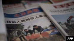 北京一家报亭展示中国国家领导人习近平参加植树活动的照片。中国媒体全方位屏蔽了有关“巴拿马文件”的任何信息。(2016年4月6日)