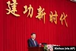 资料照:中国领导人习近平在全国政协新年茶话会上发表讲话。(2021年12月31日)
