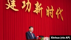 资料照:中国领导人习近平在全国政协新年茶话会上发表讲话。(2021年12月31日)