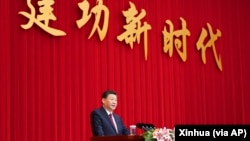 资料照:中国领导人习近平在全国政协新年茶话会上发表讲话。(2021年12月31日)