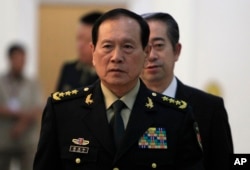2018年6月18日中国国防部长魏凤和抵达柬埔寨金边的和平宫,准备会见柬埔寨首相洪森。