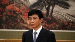 中共十九届政治局常委王沪宁在人民大会堂的媒体见面会上(2017年12月25日)。