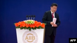 中国国家主席习近平2016年1月16日在亚投行开幕式上致辞。(法新社)