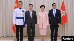 (左至右)新任警务处长萧泽颐,新任政务司司长李家超,特首林郑月娥,与新任保安局局长邓炳强出席宣誓仪式